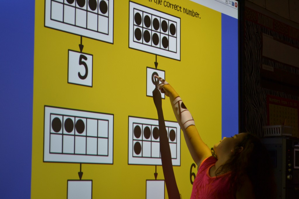 Butner student using smartboard