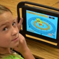 Butner student playing a learning game on a tablet