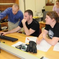 USAO students working on a computer