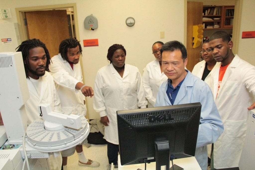 Students in class using computer at Langston University. 