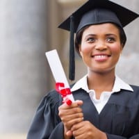 College graduate holding diploma