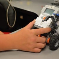 student playing with robot