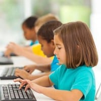 Children typing on keyboards