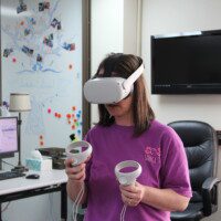 Student using virtual reality headset.